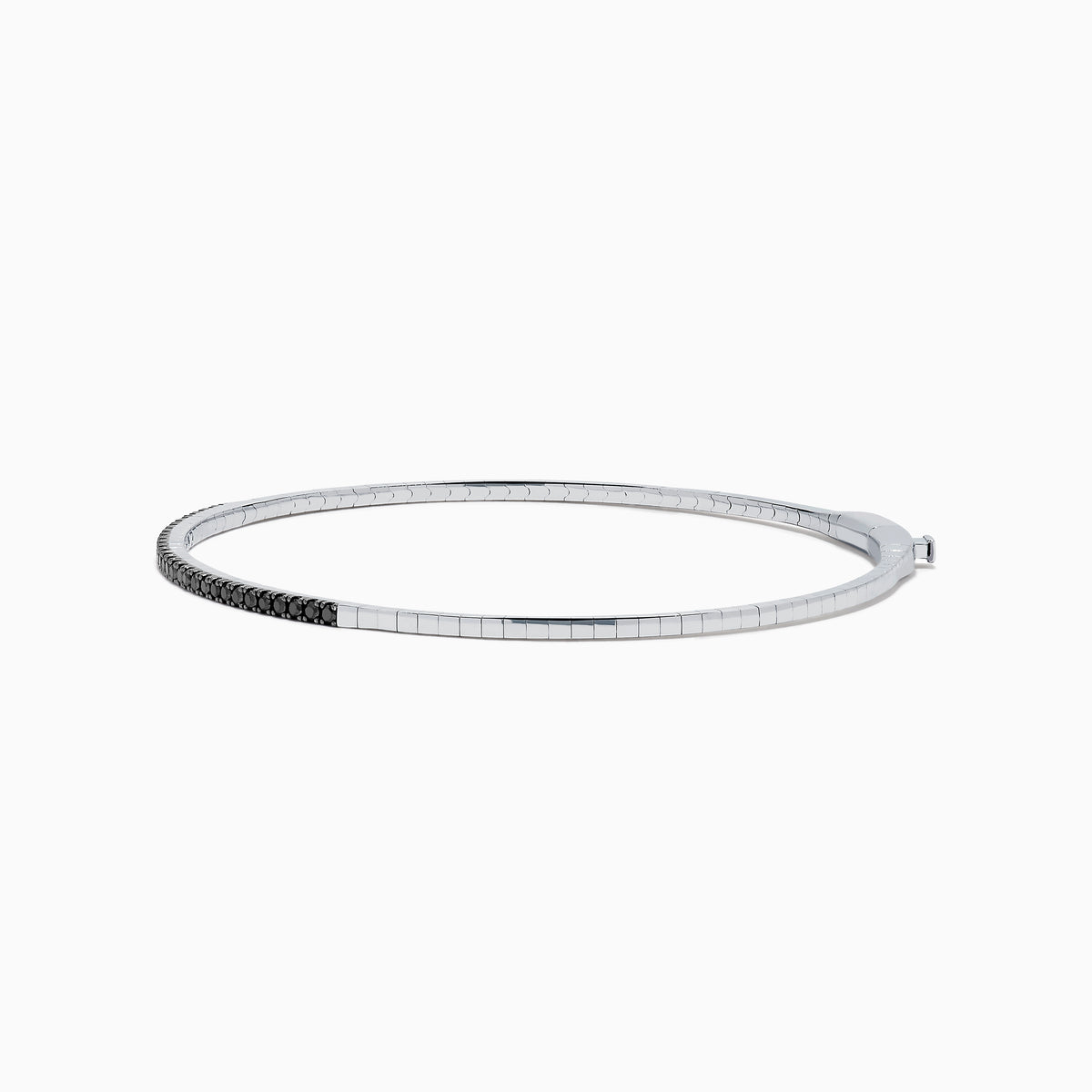 The Caviar 14K White Gold Black Diamond Bangle is a slim silver bracelet adorned with a row of small black diamonds, reminiscent of caviar, displayed on a white background.