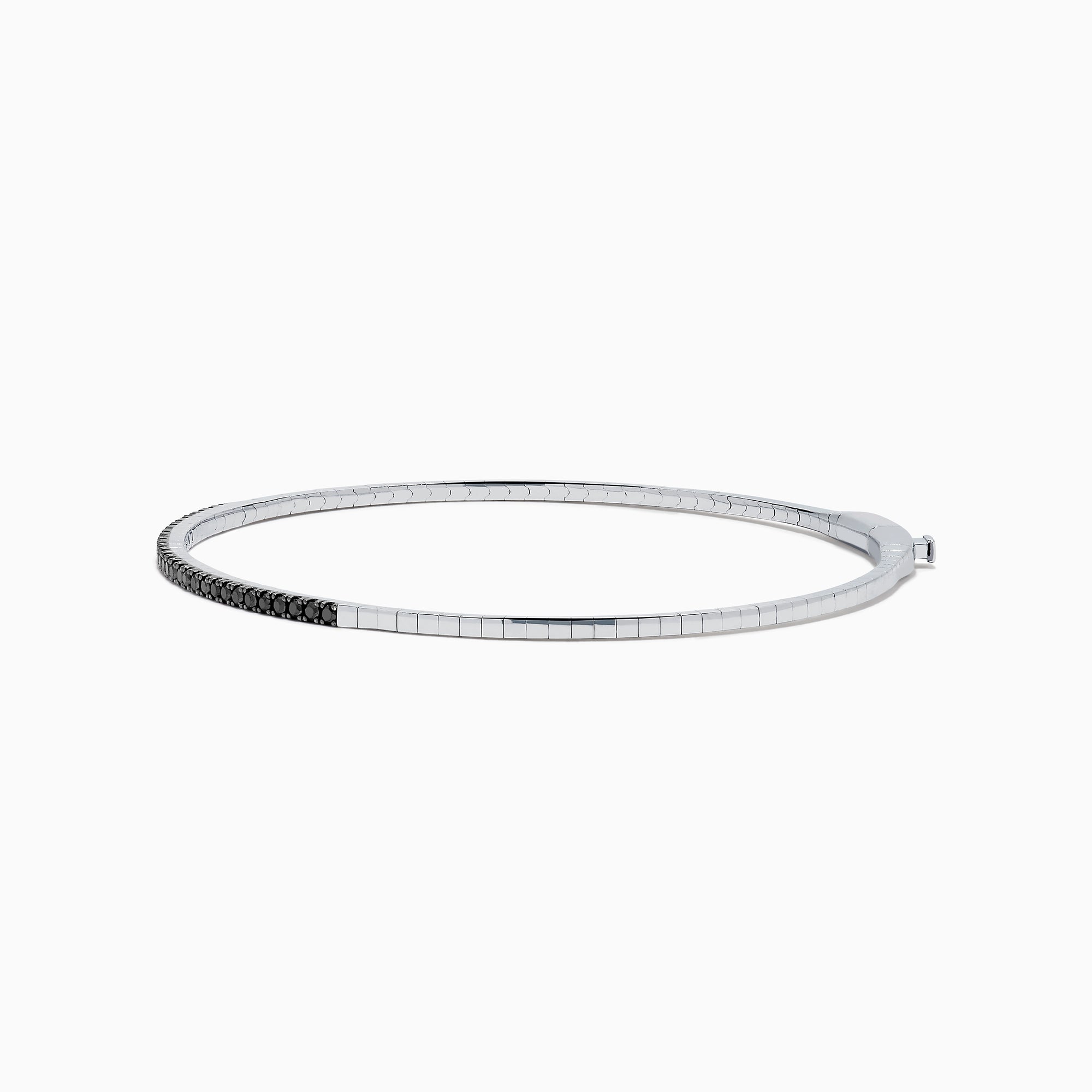The Caviar 14K White Gold Black Diamond Bangle is a slim silver bracelet adorned with a row of small black diamonds, reminiscent of caviar, displayed on a white background.