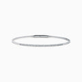 The Classique 14K White Gold Flexible Diamond Bangle features a sleek, minimalist design with a polished finish and a thin row of sparkling diamonds along the top half for effortless elegance.