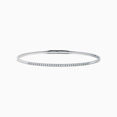 The Classique 14K White Gold Flexible Diamond Bangle features a sleek, minimalist design with a polished finish and a thin row of sparkling diamonds along the top half for effortless elegance.