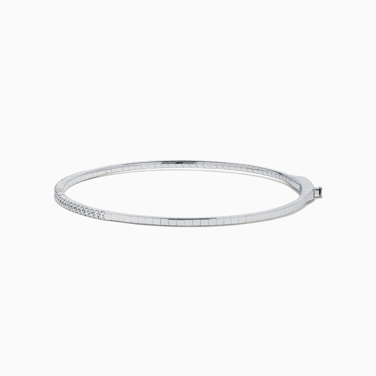 The Classique 14K White Gold Flexible Diamond Bangle features a sleek, minimalist design with a polished finish and a thin row of sparkling diamonds along the top half for effortless elegance.