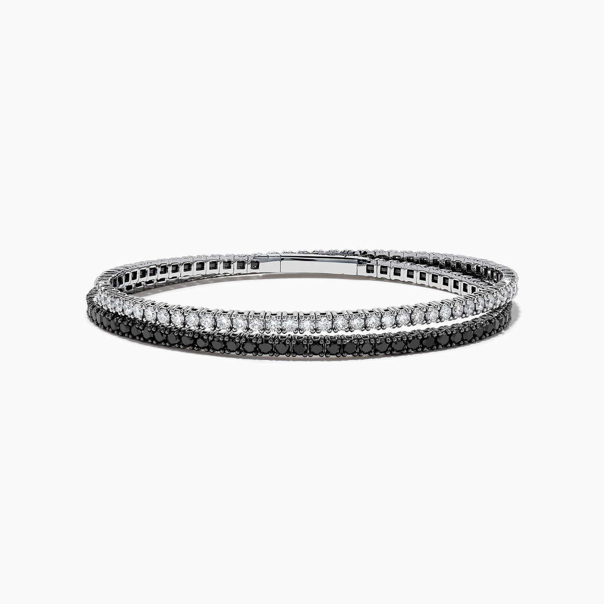 The 14k White Gold Black and White Diamond Double Wrap Bracelet 6.77 TCW features two rows: one with sparkling white diamonds and the other with striking black diamonds, creating a bold yet elegant contrast.
