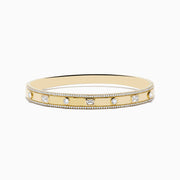 The DOro 14K Yellow Gold Bezel Set Diamond Bangle 1.72 TCW features a row of round and rectangular diamonds in bezels with delicate beaded edges, all beautifully displayed against a white background.