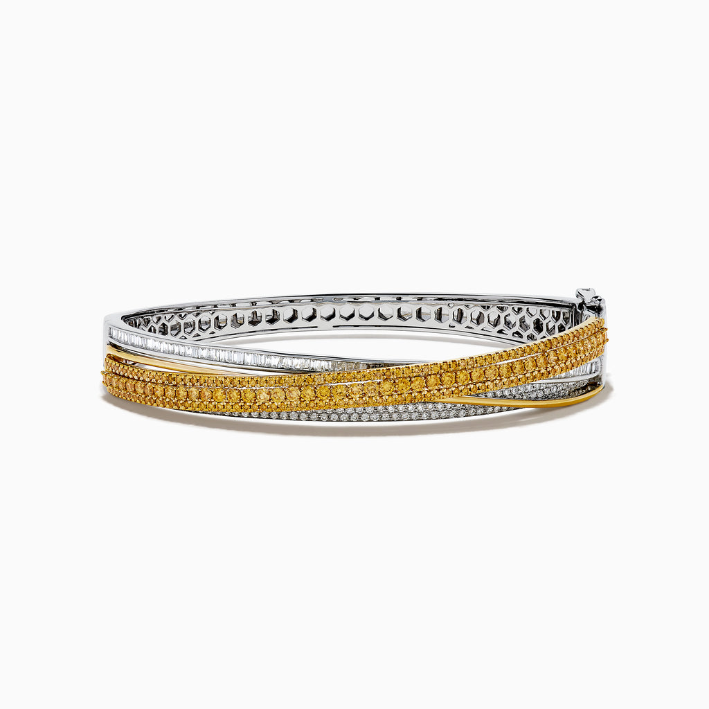 The 14K Two Tone Gold Yellow and White Diamond Pave Crossover Bangle features elegant overlapping rows of yellow and white diamonds in a sparkling, layered design.