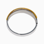 The 14K Two Tone Gold Yellow and White Diamond Pave Crossover Bangle features elegant overlapping rows of yellow and white diamonds in a sparkling, layered design.