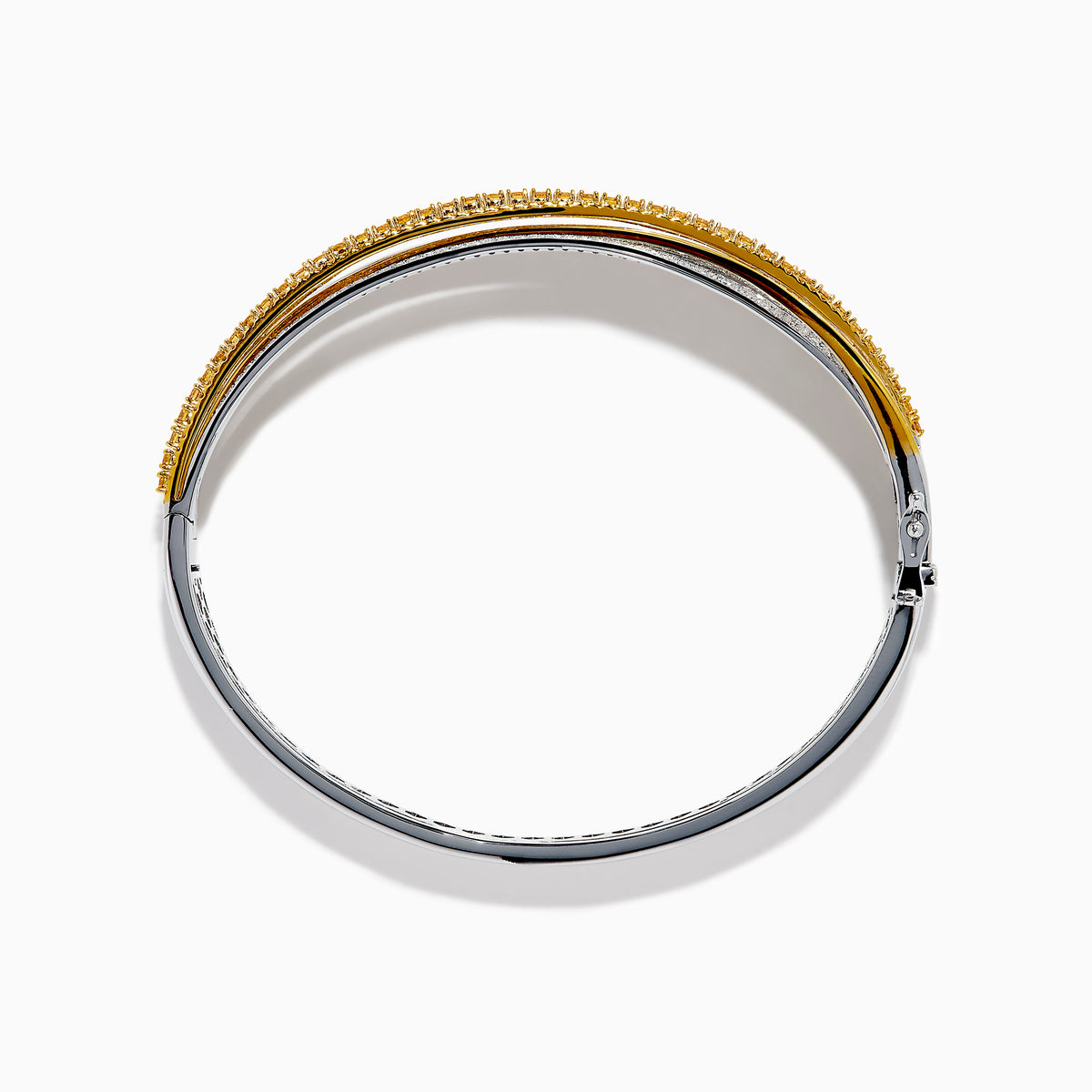 The 14K Two Tone Gold Yellow and White Diamond Pave Crossover Bangle features elegant overlapping rows of yellow and white diamonds in a sparkling, layered design.