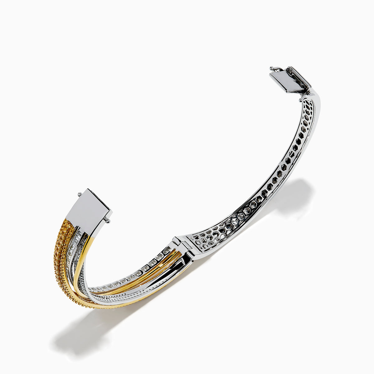 The 14K Two Tone Gold Yellow and White Diamond Pave Crossover Bangle features elegant overlapping rows of yellow and white diamonds in a sparkling, layered design.