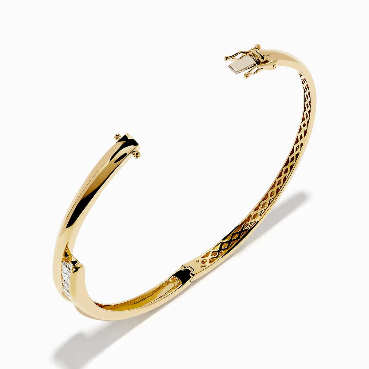 The D'Oro 14K Yellow Gold Channel Set Diamond Bangle features an open design with channel set round white diamonds on a horizontal bar and an inner band with an elegant lattice pattern.