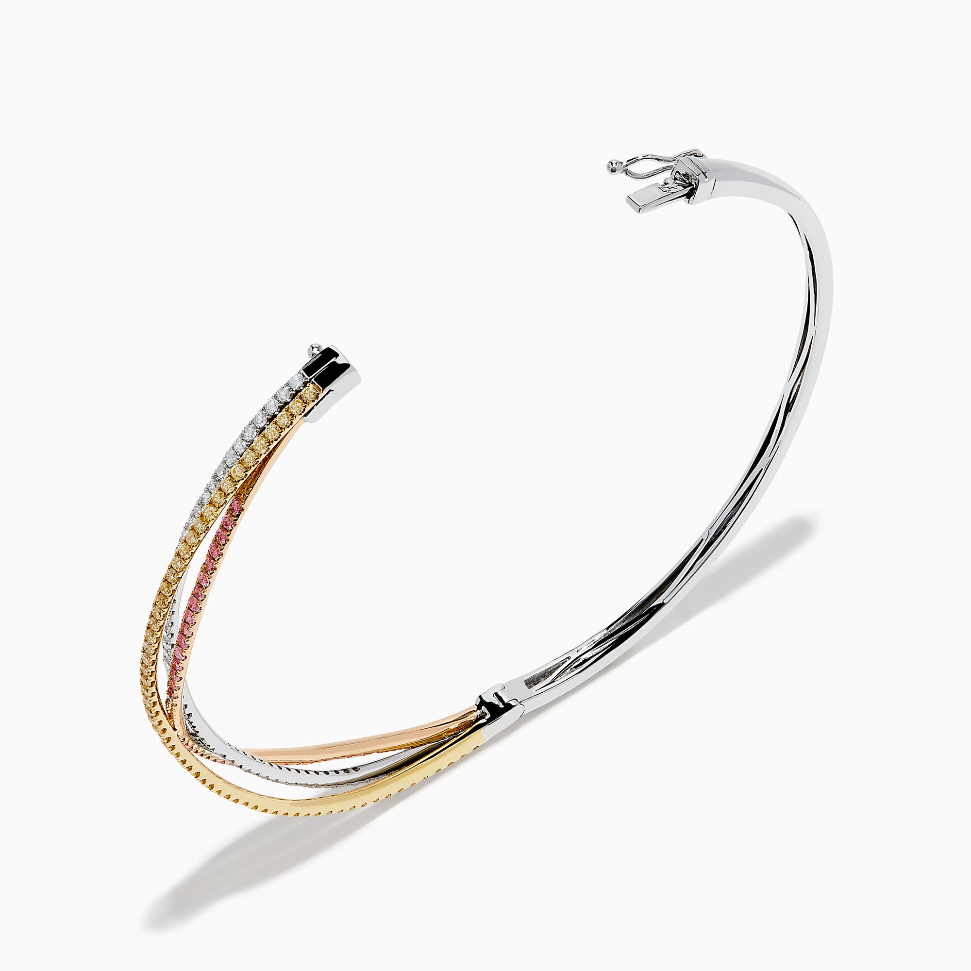 The 18K 3-Tone Gold White, Yellow and Pink Diamond Criss Cross Bangle features three intertwined rows of white, yellow, and pink diamonds set in an elegant, polished design.