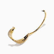 The 14K Yellow Gold Diamond Sculptural Twist Bangle features a wavy twist design with sparkling white diamonds set along the curve on a sleek gold background.