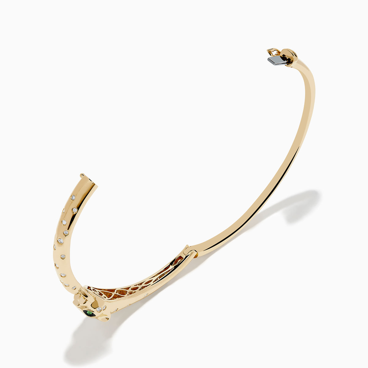 The Signature 14K Yellow Gold Diamond and Tsavorite Bangle features a panther’s head with tsavorite eyes, sparkling stones along the band, and a gem-encrusted circular link clasped in its mouth.