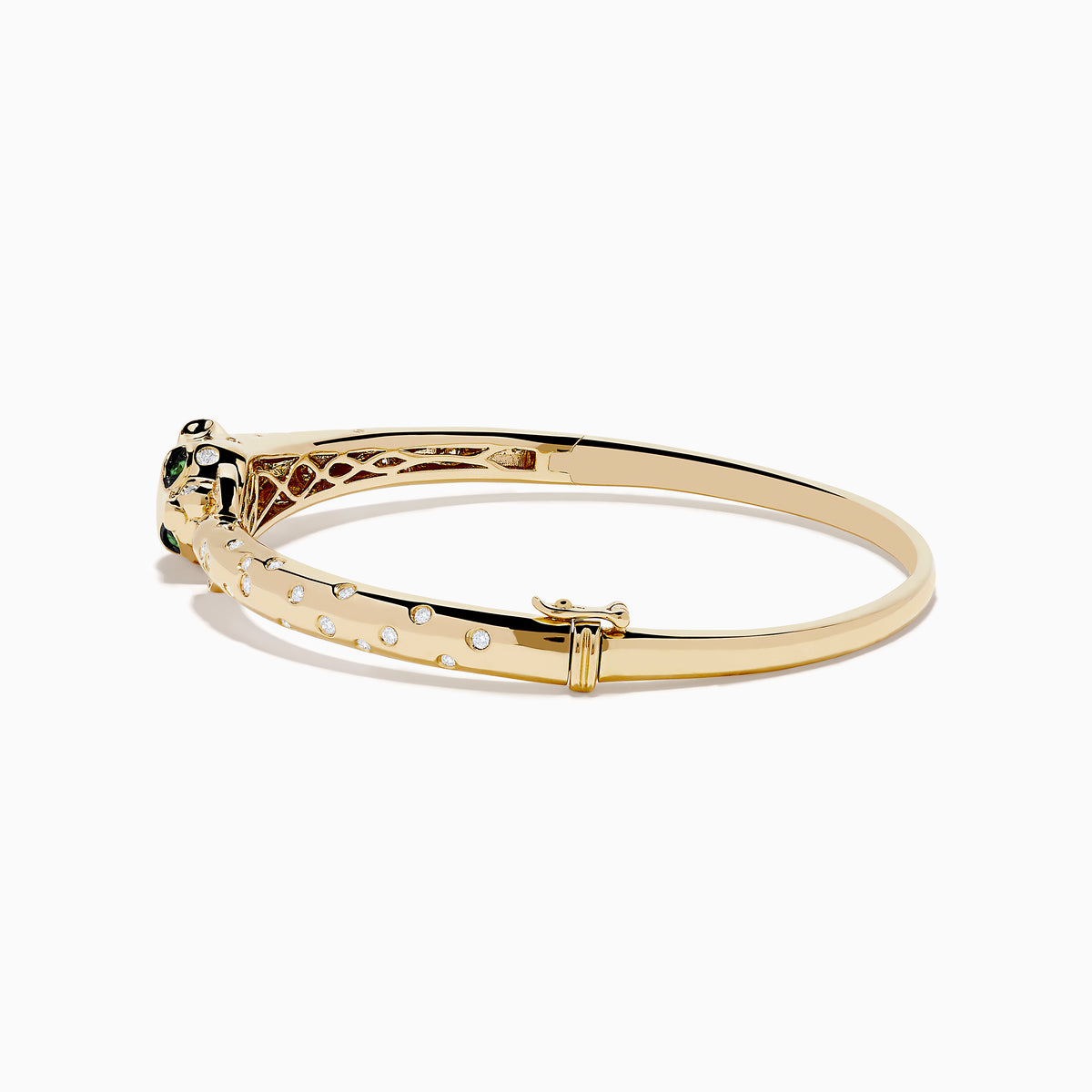 The Signature 14K Yellow Gold Diamond and Tsavorite Bangle features a panther’s head with tsavorite eyes, sparkling stones along the band, and a gem-encrusted circular link clasped in its mouth.