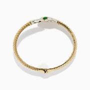 The 14K Yellow Gold White and Green Enamel Snake Bypass Bangle features a white and gold scale pattern on the head and tail, highlighted with green enamel eyes.
