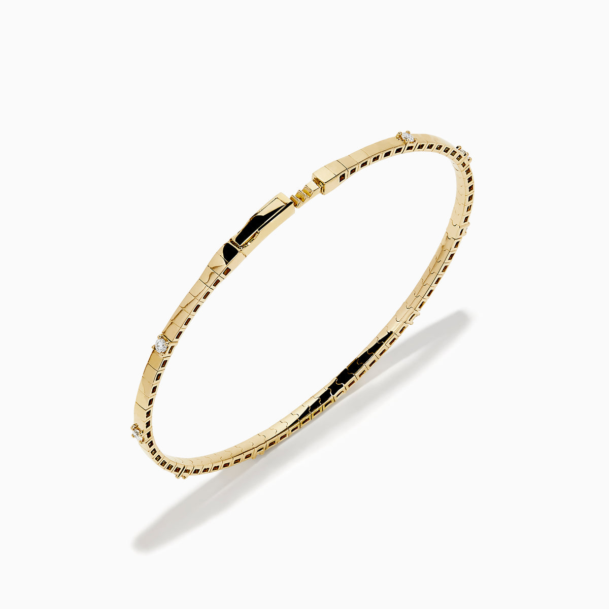 The 14K Yellow Gold Diamond Station Flexible Bangle features smooth rectangular links and evenly spaced round diamonds, offering minimalist elegance in a thin, flexible design perfect for any occasion.