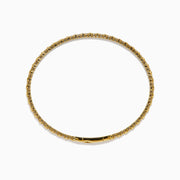The 14K Yellow Gold Diamond Flex Bangle features a single row of sparkling white diamonds and a secure clasp, presented against a white background.