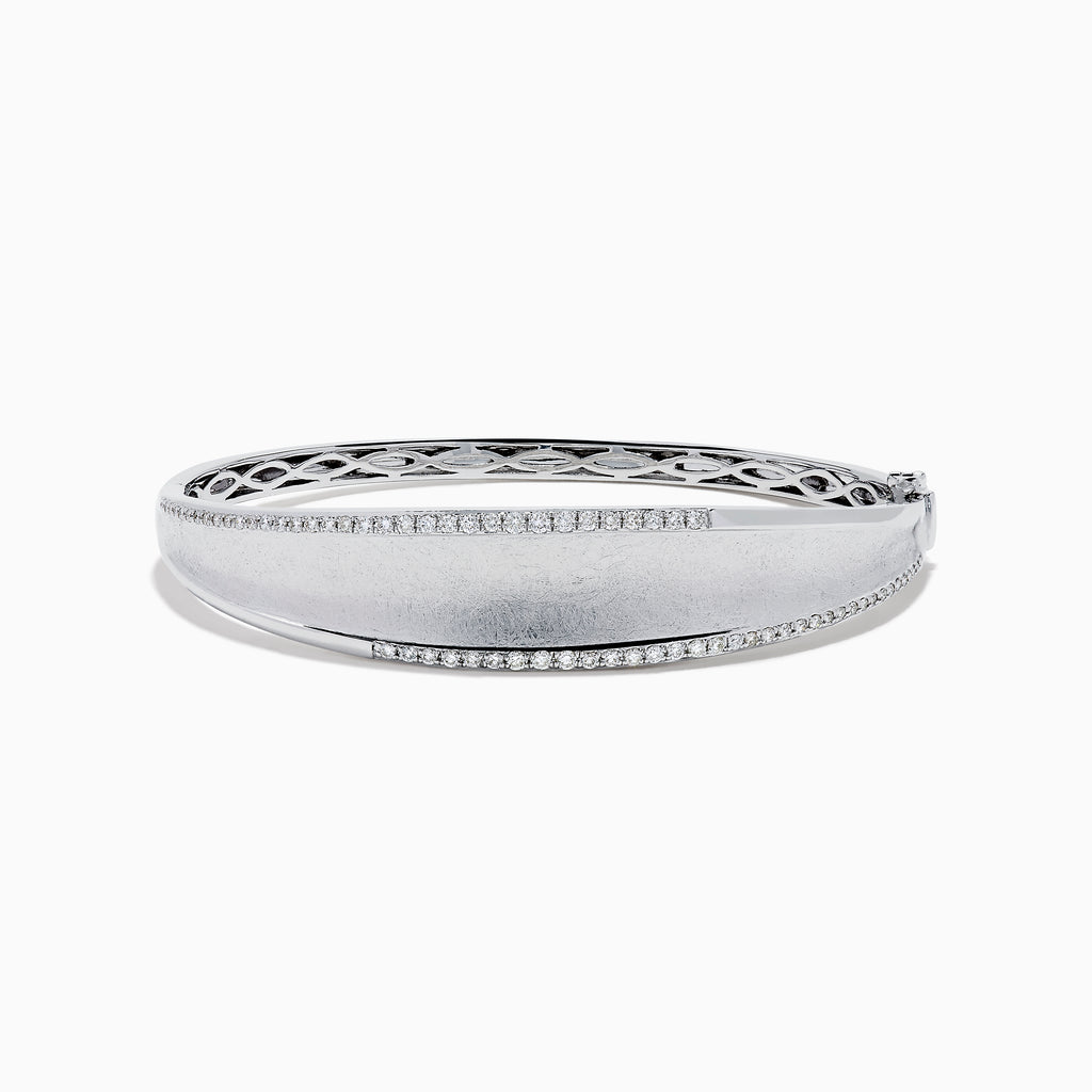 The 925 Sterling Silver Diamond Accented Bangle features a smooth, slightly curved center, two rows of sparkling stones along the edges, and a decorative lattice pattern inside.