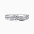 The Classique 14K White Gold Diamond Crossover Bangle features a twisted knot design with sparkling diamonds, shown against a plain white background.