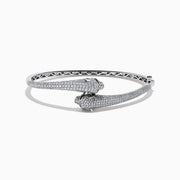 The Signature 14K White Gold White and Black Diamond Panther Bypass Bangle showcases two panther heads with sparkling diamond accents facing each other in an elegant, bypass-style design.