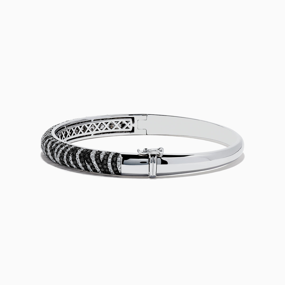 The 14k White Gold Black and White Diamond Zebra Print Bangle features a striking zebra stripe design with black and white diamond accents, elegantly set against plain white gold.