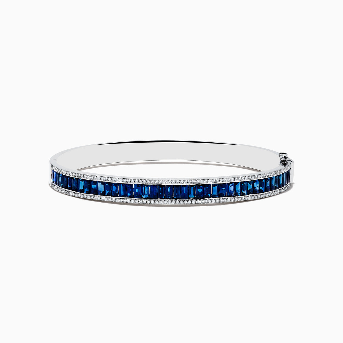 The Royale Bleu 14K White Gold Blue Sapphire and Diamond Bangle showcases a row of rectangular blue sapphires bordered by sparkling diamonds, elegantly set against a white background.
