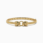 The Signature 14K Yellow Gold Emerald and Diamond Panther Bangle features two facing leopard heads with emerald-green eyes and pavé-set diamonds along the band, inspired by the iconic panther design.