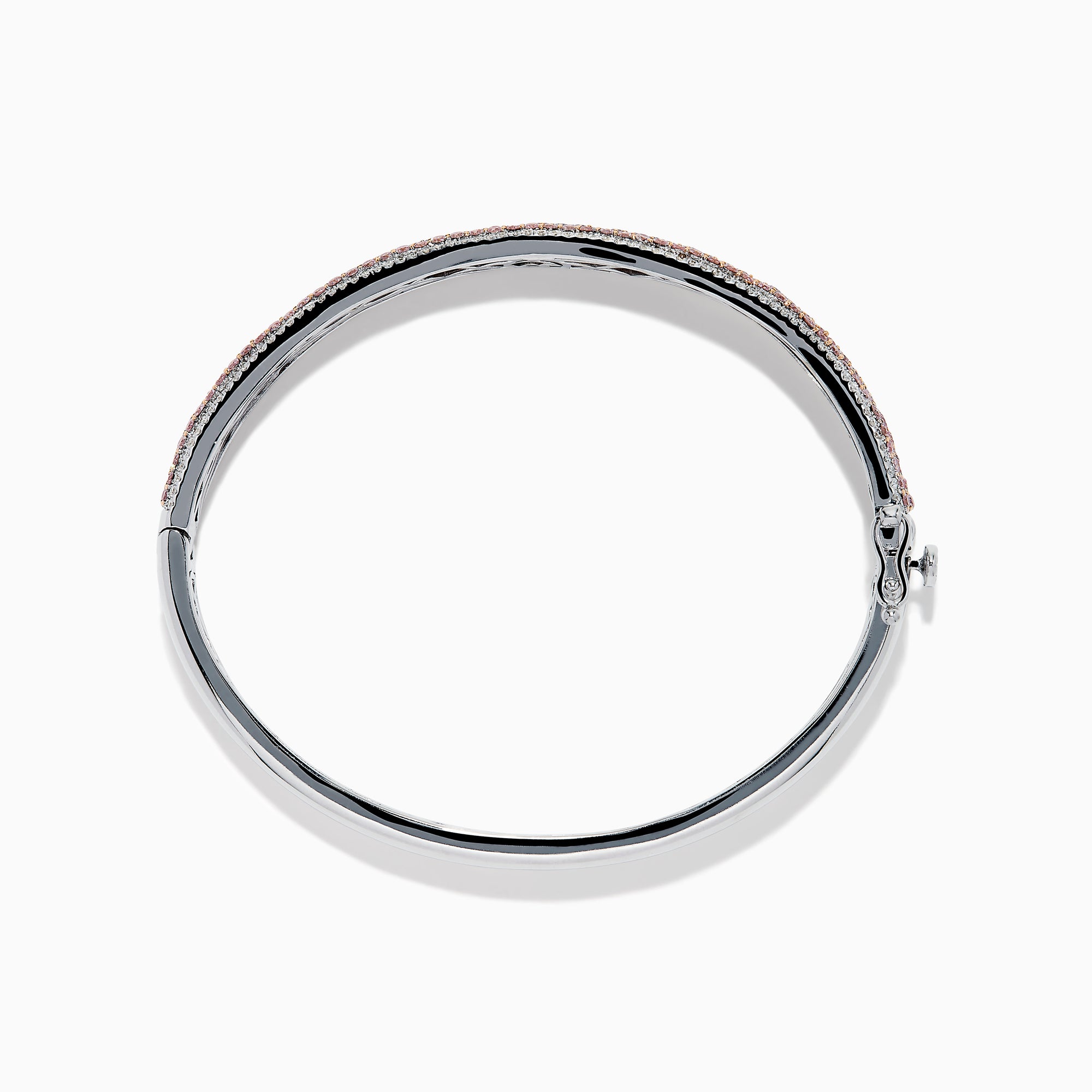 The 14K Two Tone Gold Pink and White Diamond Bangle features an intricate cutout design, accented by a central band with sparkling pink and white diamonds.