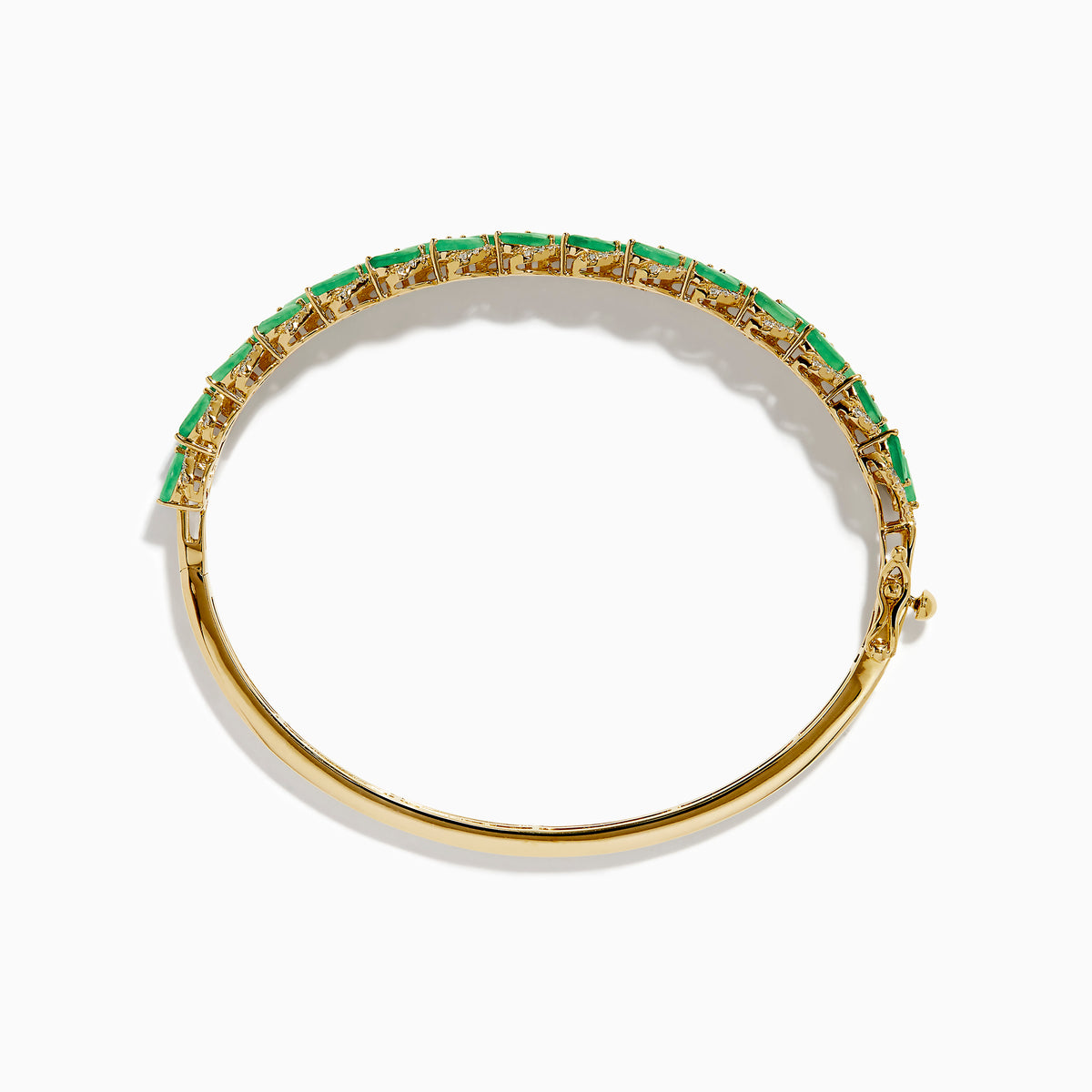 The 14K Yellow Gold Emerald and Diamond Marquise Leaf Bangle showcases an intricate leaf design with alternating emeralds and diamonds set along the band.