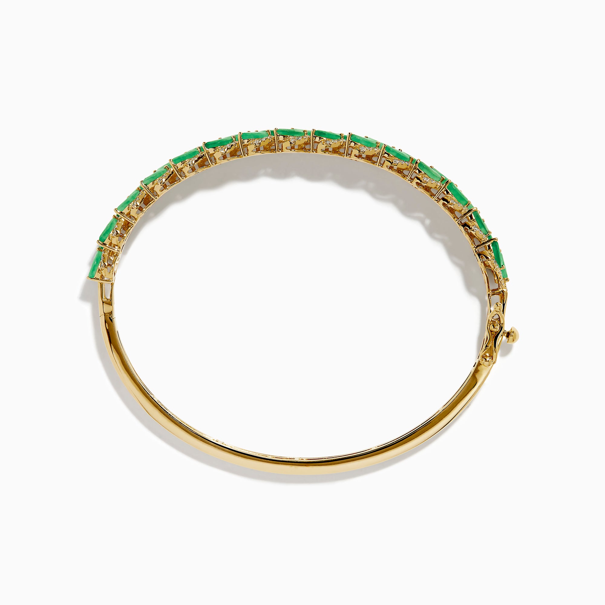 The 14K Yellow Gold Emerald and Diamond Marquise Leaf Bangle showcases an intricate leaf design with alternating emeralds and diamonds set along the band.