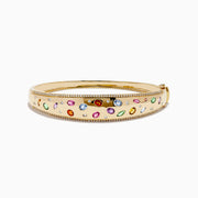 The Watercolors 14K Yellow Gold Multi Sapphire Diamond Bangle features sparkling diamonds and vibrant multi-colored sapphires in various shapes, all set against a plain white background.