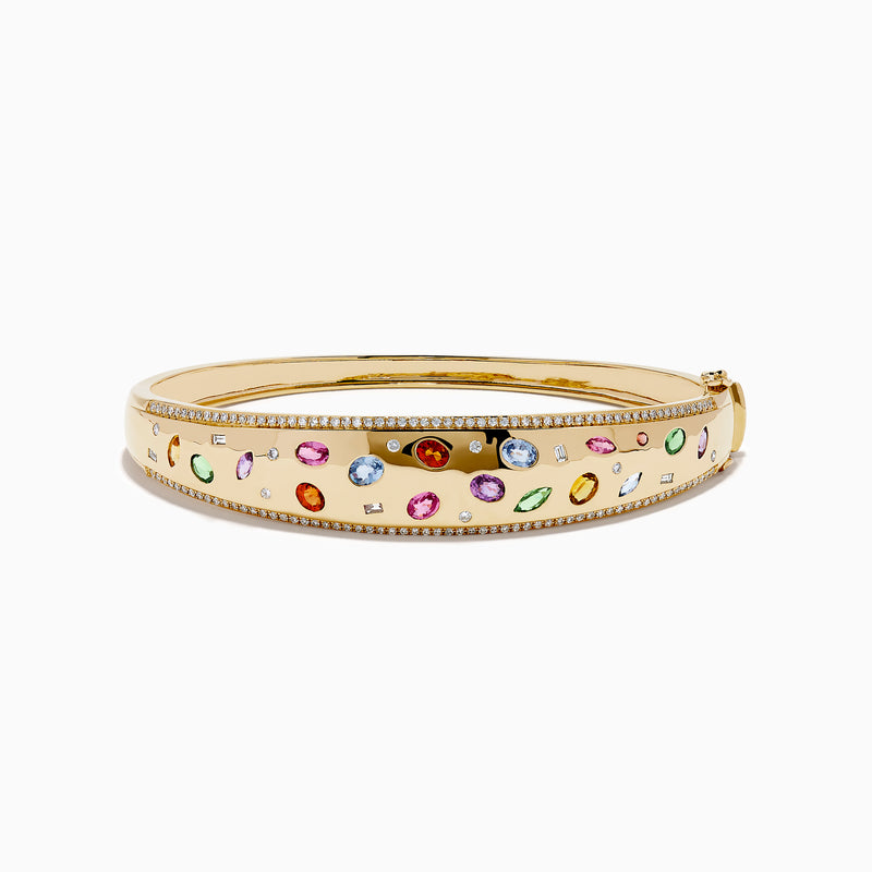 The Watercolors 14K Yellow Gold Multi Sapphire Diamond Bangle features sparkling diamonds and vibrant multi-colored sapphires in various shapes, all set against a plain white background.