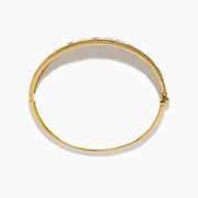 The Watercolors 14K Yellow Gold Multi Sapphire Diamond Bangle features sparkling diamonds and vibrant multi-colored sapphires in various shapes, all set against a plain white background.