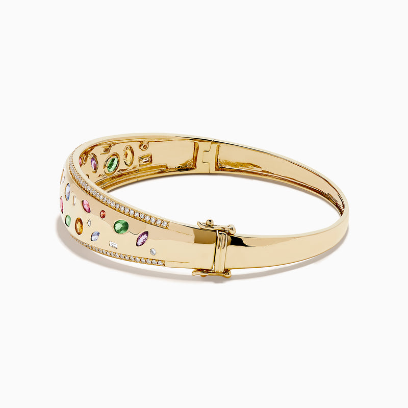 The Watercolors 14K Yellow Gold Multi Sapphire Diamond Bangle features sparkling diamonds and vibrant multi-colored sapphires in various shapes, all set against a plain white background.