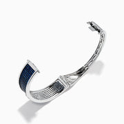 The Sterling Silver Pavé Blue Sapphire and Diamond Anchor Bangle features a small anchor design at the center, encrusted with blue sapphires and diamonds, shown against a plain white background.