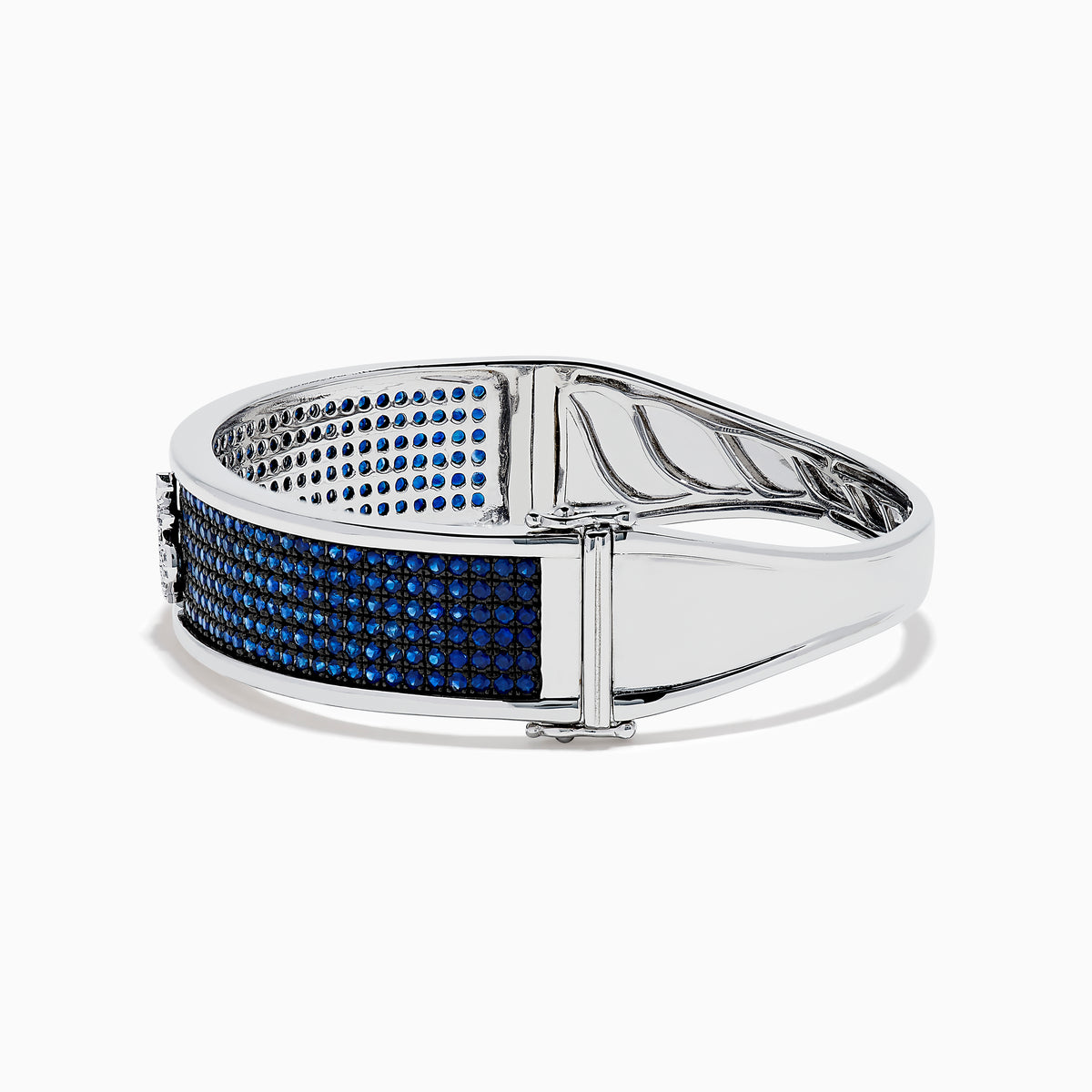 The Sterling Silver Pavé Blue Sapphire and Diamond Anchor Bangle features a small anchor design at the center, encrusted with blue sapphires and diamonds, shown against a plain white background.