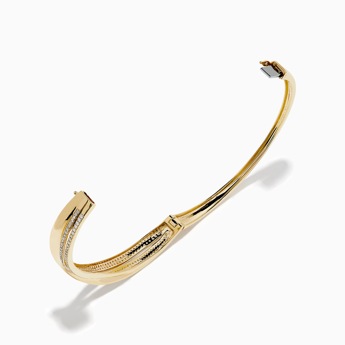 The 14K Yellow Gold Diamond Crossover Ribbon Bangle features overlapping bands in a crossover ribbon style, with some bands encrusted with sparkling diamonds for an elegant, layered look.