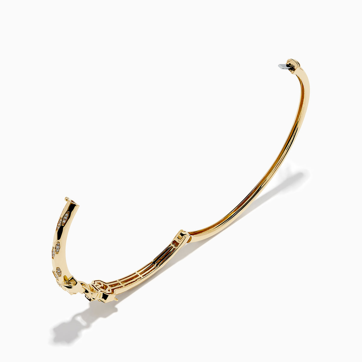 The Signature 14K Gold Diamond and Tsavorite Double Panther Head Bangle features two intertwined bands with geometric black and green enamel, diamond accents, and a panther motif, shown on a white background.