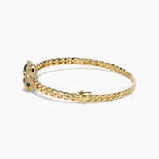 Introducing the Signature 14K Yellow Gold Diamond Chain-Link Panther Bangle Bracelet—a bold reinterpretation of the classic diamond bangle. This striking piece showcases an elegant chain-link design in 14K yellow gold, featuring two intricately sculpted panther heads adorned with green and clear gemstones, joined at the center by a sparkling, circular, gem-encrusted link.