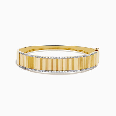 The DOro 14K Yellow Gold Diamond Bangle showcases a textured vertical striped design with sparkling diamonds bordering the top and bottom edges.