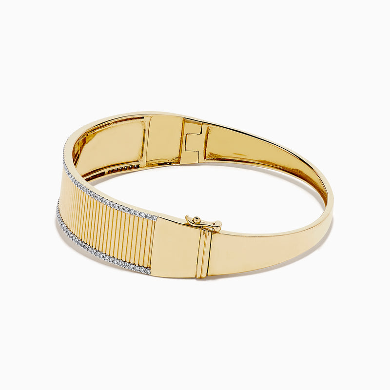The DOro 14K Yellow Gold Diamond Bangle showcases a textured vertical striped design with sparkling diamonds bordering the top and bottom edges.