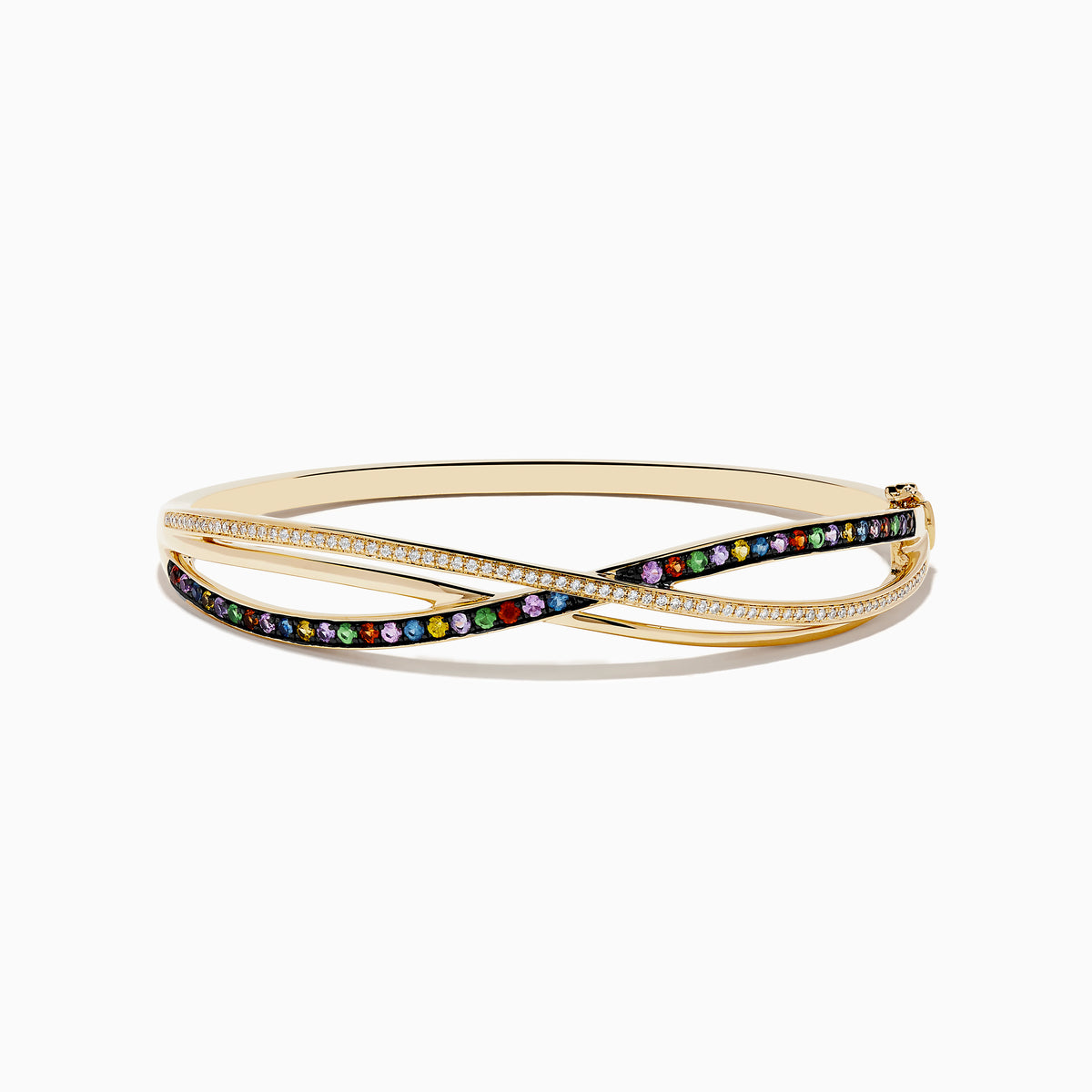 The Watercolors 14K Yellow Gold Multi Sapphire Bangle features crisscrossing bands—one with diamonds, the other adorned with vibrant sapphires—displayed on a white background.