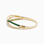 The Brasilica 14K Yellow Gold Emerald and Diamond Bangle features interwoven bands—one set with diamonds, the other with emeralds—beautifully displayed on a white background.