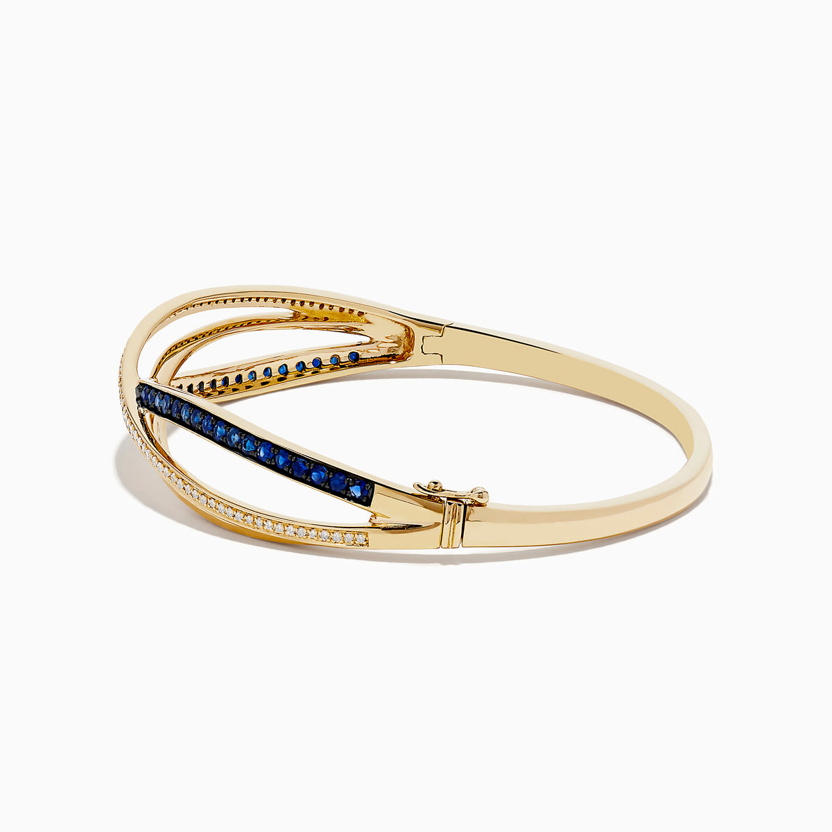 The Royal Bleu 14K Yellow Gold Blue Sapphire and Diamond Bangle showcases two intertwined bands—one set with diamonds, the other with vivid blue sapphires—in a graceful crisscross design.