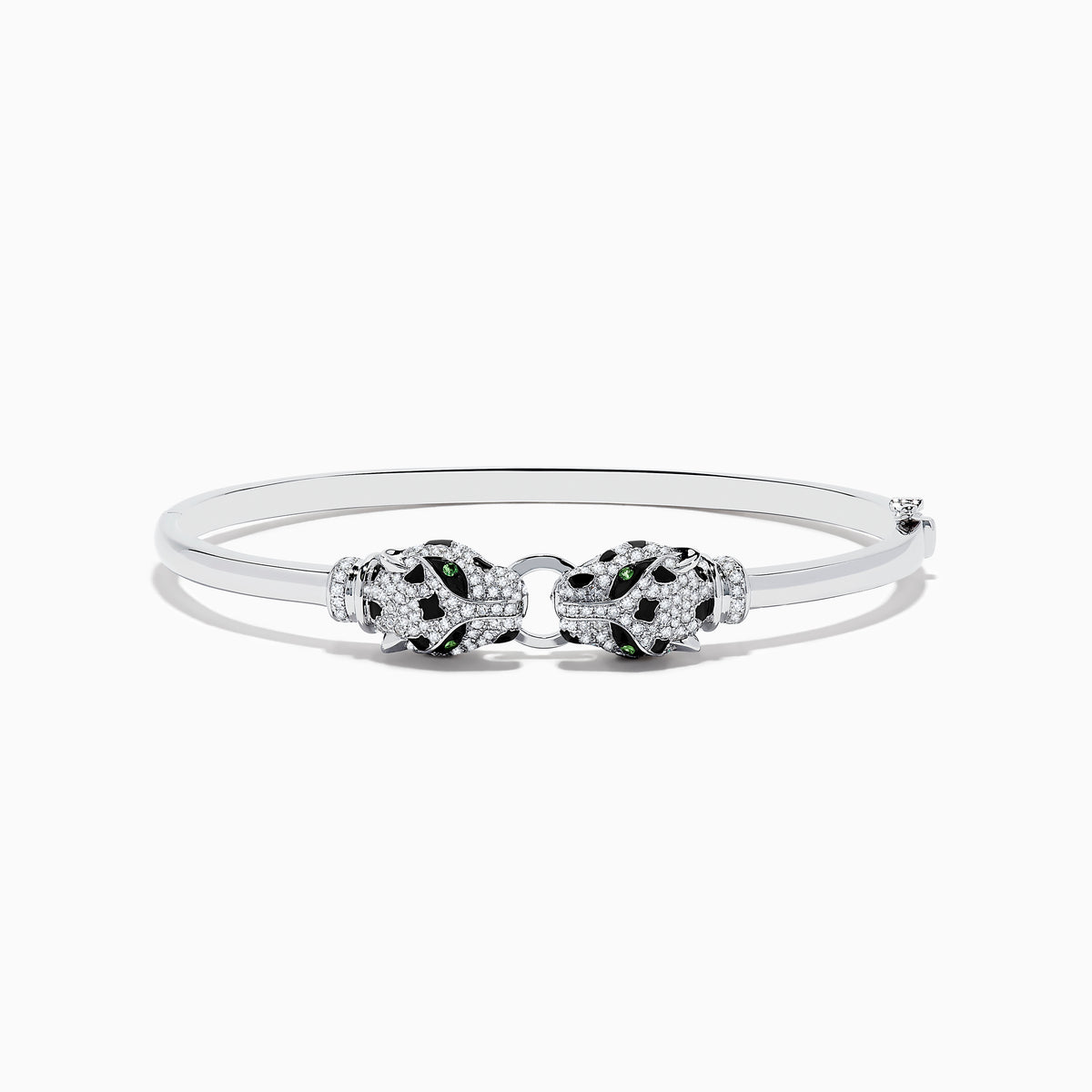The Signature 14K White Gold Diamond and Tsavorite Bangle showcases two intricate panther heads facing each other, adorned with sparkling diamonds and vibrant tsavorite eyes.