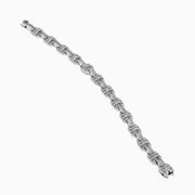 The Classique 14K White Gold Diamond Bracelet features interlocking H-shaped links and is adorned with sparkling diamonds, offering a polished, luxurious look.