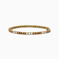 The Espresso 14K Yellow Gold Brown and White Diamond Tennis Bracelet features a single row of alternating brown and white diamonds, showcased against a plain white background.