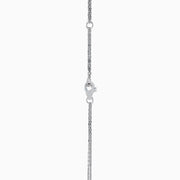 The 14K White Gold Fresh Water Pearl and Diamond Pendant features a round pendant with a central freshwater pearl, surrounded by sparkling diamonds, hanging from a fine white gold chain for an elegant look.
