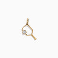 The 14K Yellow Gold Diamond Pickleball Paddle Charm is shaped like a paddle with a small round diamond where the ball would be, shown on a plain white background—an elegant jewelry piece for pickleball lovers.