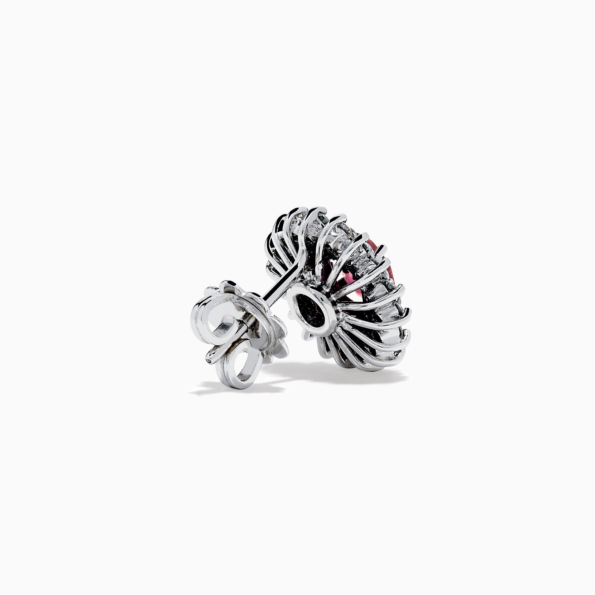 The Ruby Royale 18K White Gold Ruby and Diamond Earrings feature oval red rubies encircled by two halos of sparkling white diamonds, all set in elegant 18K white gold.