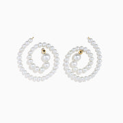 The 14K Yellow Gold Freshwater Pearl Spiral Earrings feature small freshwater pearls and gold accents, displayed on a white background.