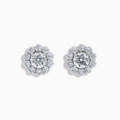 The Star Lab Grown Diamond Fleur Stud Earrings feature a central round diamond with a floral halo of smaller diamonds, beautifully set in 18K white gold for a timeless look.